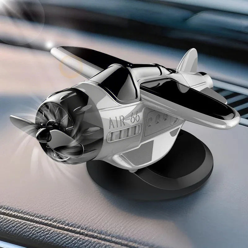 Mini airplane-shaped car air freshener accessory on dashboard, premium auto tool from clarioy