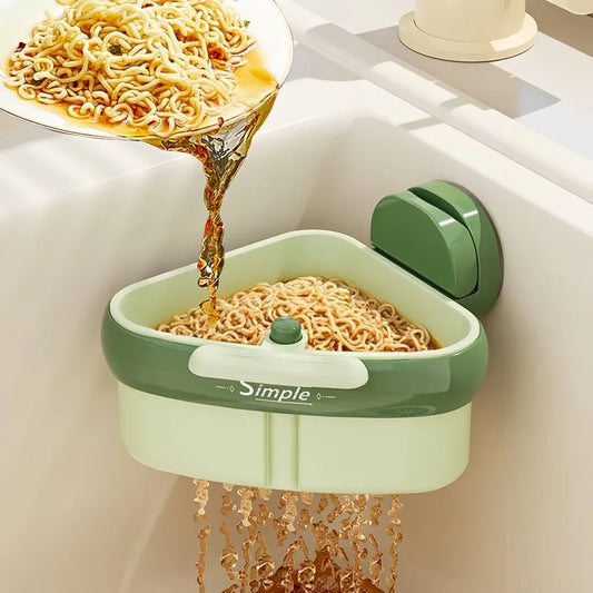 Green kitchen strainer basket draining noodles in sink, homeware from clarioy.