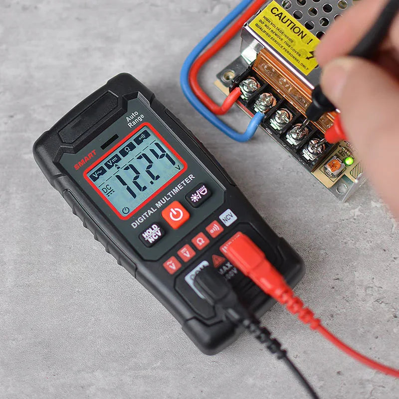 Digital multimeter measuring voltage on electronic circuit, premium auto tool from clarioy