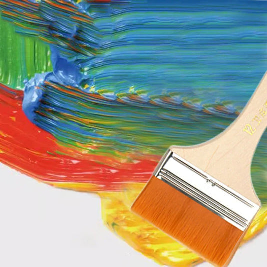 Flat paintbrush blending vibrant blue, green, red, and yellow paint strokes on white surface