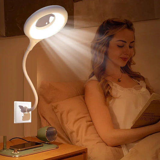 Woman reading in bed under modern plug-in LED reading lamp, nightstand with phone at clarioy