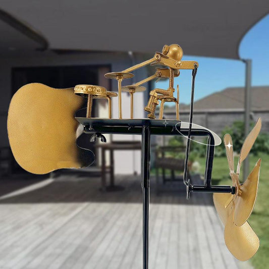 Metal drummer wind spinner garden decor on patio, unique homeware at clarioy