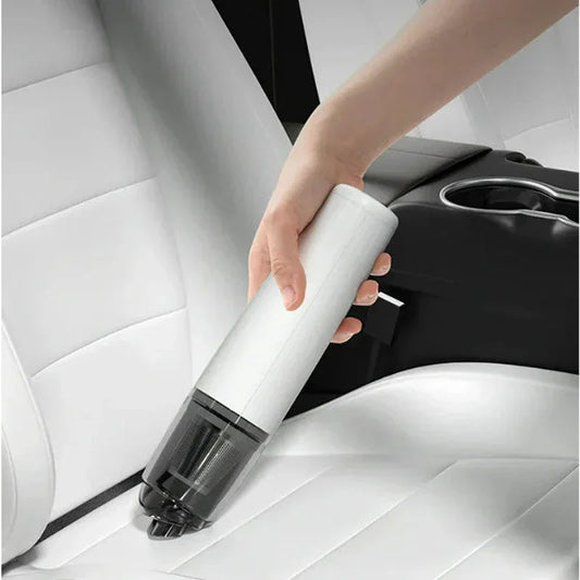 Handheld cordless vacuum cleaning white car seat, automotive tool from clarioy.