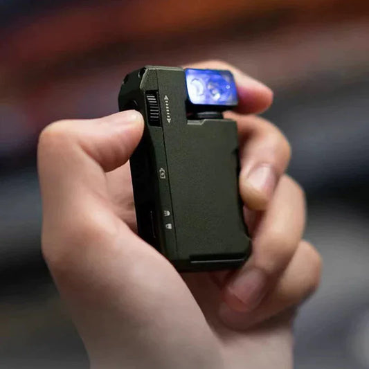 Hand holding a compact black electronic lighter with blue flame, premium gadget from clarioy