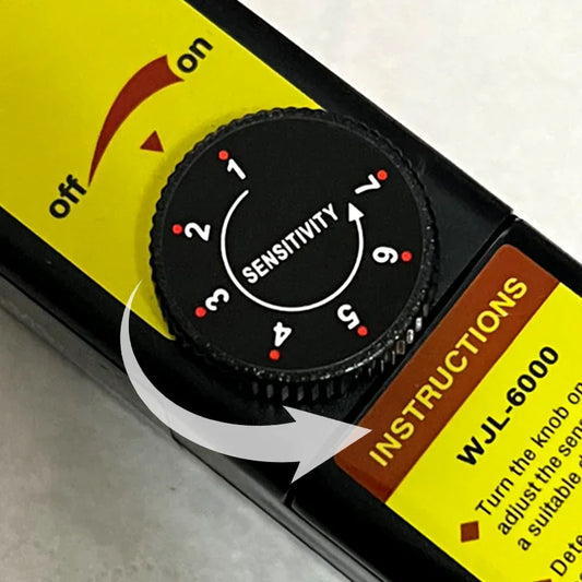 Close-up of clarioy auto tool WJL-6000 sensitivity dial and instruction label