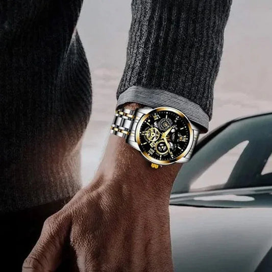 Luxury men's skeleton watch with gold and silver band, showcased on wrist outdoors
