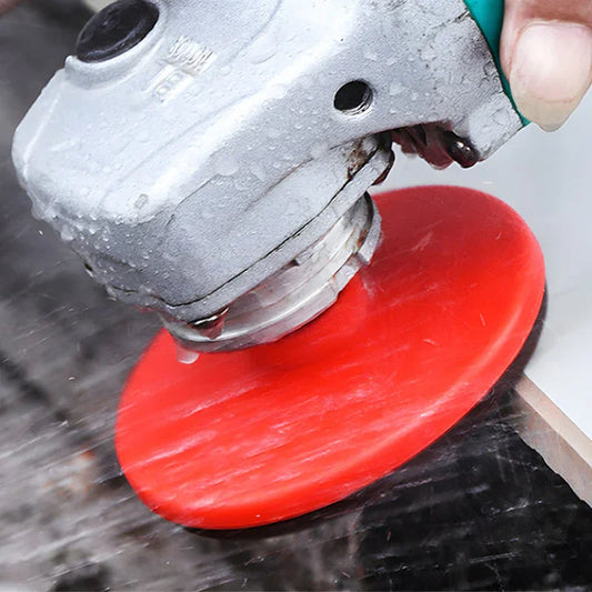 Electric angle grinder tool with red polishing pad in use on glass, premium auto tool from clarioy