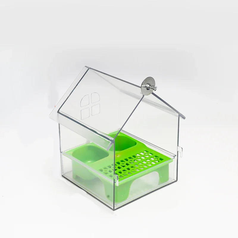 Clear acrylic house-shaped bird feeder with green food trays, homeware at clarioy