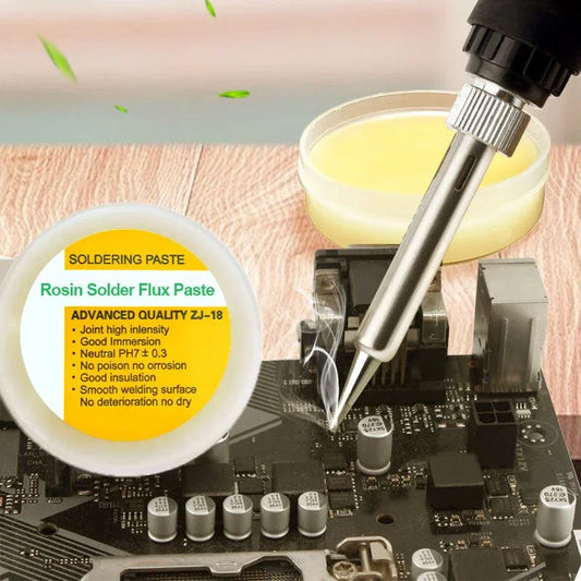 Rosin solder flux paste and soldering iron on a motherboard, clarioy electronics tool.