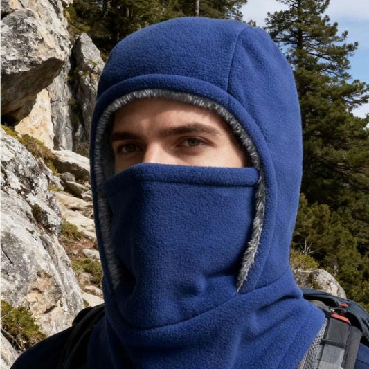 Man wearing blue fleece balaclava for outdoor hiking, forest and rocky mountain background, clarioy
