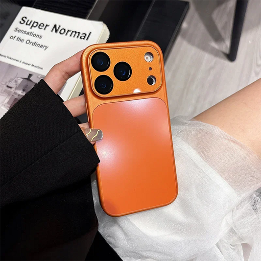 Orange iPhone case with card holder, held in hand, modern homeware setting, clarioy