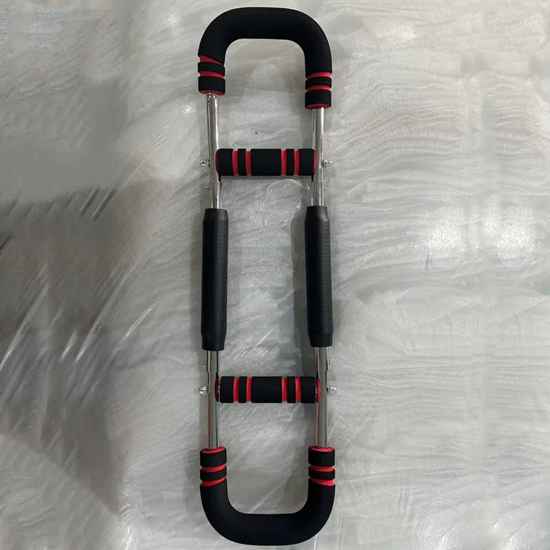 Adjustable push up bar with black and red foam grips on a light textured surface, fitness homeware