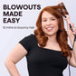 Smiling woman using a pink hair styling tool for easy blowouts, text reads 'Blowouts Made Easy'.