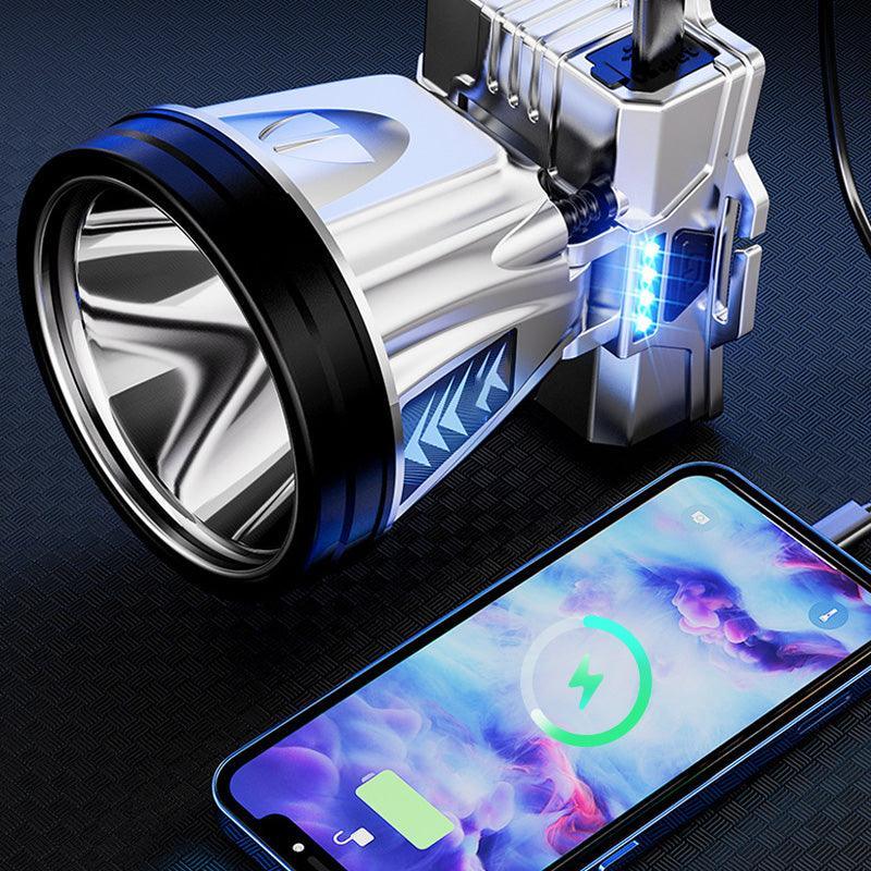 Metallic rechargeable LED flashlight charging a smartphone, premium auto tool from clarioy