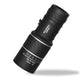 Compact black monocular telescope with 16x52 zoom, labeled for day and night use, on white background.
