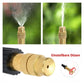 Adjustable brass spray nozzle for garden hose, showing mist and jet settings on green background
