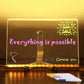 LED message board with 'Everything is possible' and 'BIG SALE' written, colorful markers in front