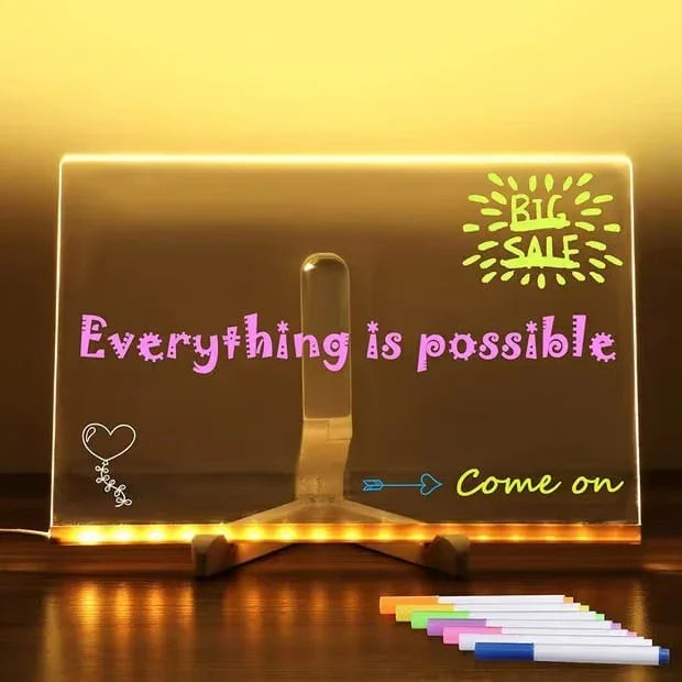 LED message board with 'Everything is possible' and 'BIG SALE' written, colorful markers in front