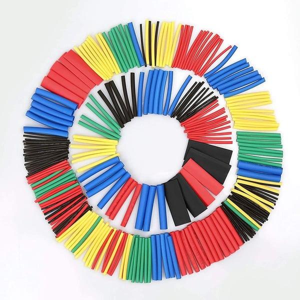 Assorted colored heat shrink tubing set for electronics and auto tools, arranged in circles on white background.