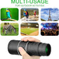 Hand holding black monocular telescope for outdoor activities, bird watching, travel, and sports