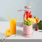 Fruit blender bottle with colorful fruits and a glass of orange juice on a kitchen counter, premium homeware by clarioy