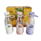 Set of three portable mini juice blenders in white, pink, and purple with clarioy boxes.