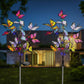Colorful butterfly solar garden lights in front of modern house at night, clarioy outdoor decor