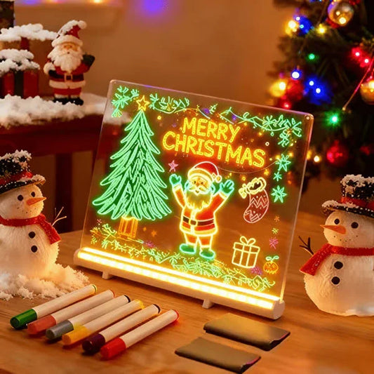 Light up acrylic Christmas drawing board with Merry Christmas, Santa, tree, snowmen, and markers on festive table, clarioy homeware decor.