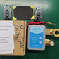 Clarioy smart car battery disconnect switch kit with remotes, wiring, and accessories on green surface