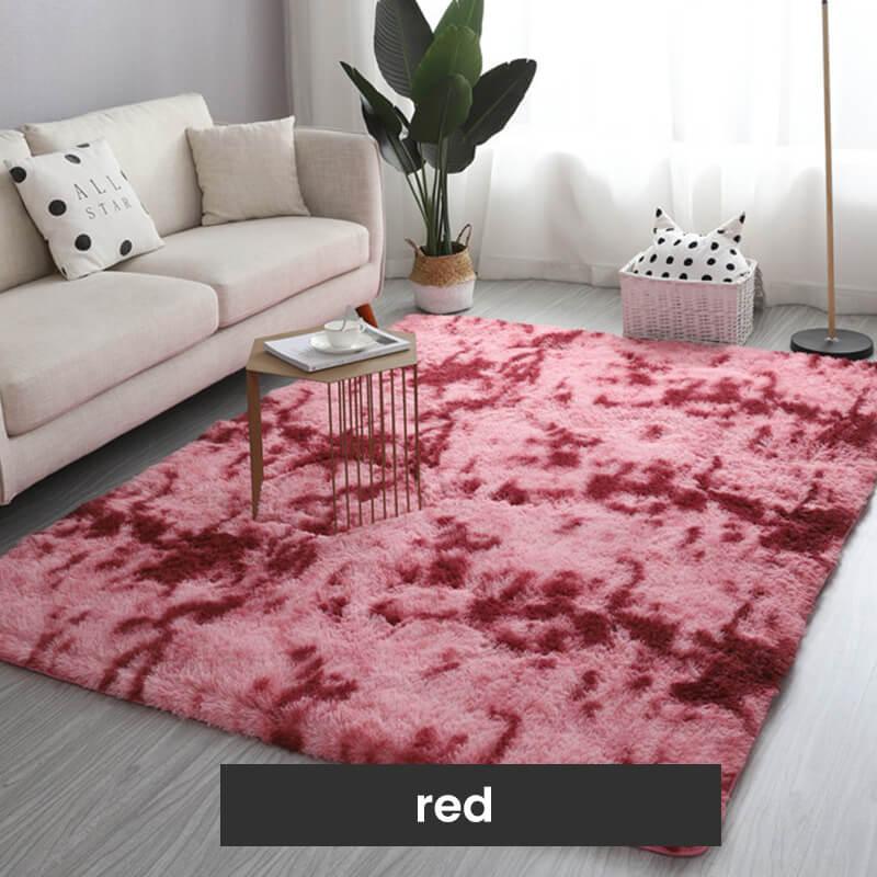 Red plush area rug in modern living room with beige sofa, plant, and decorative pillows, clarioy homeware.