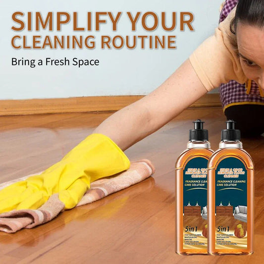 Person cleaning wood floor with yellow gloves and 5-in-1 stain odor remover cleaner bottles