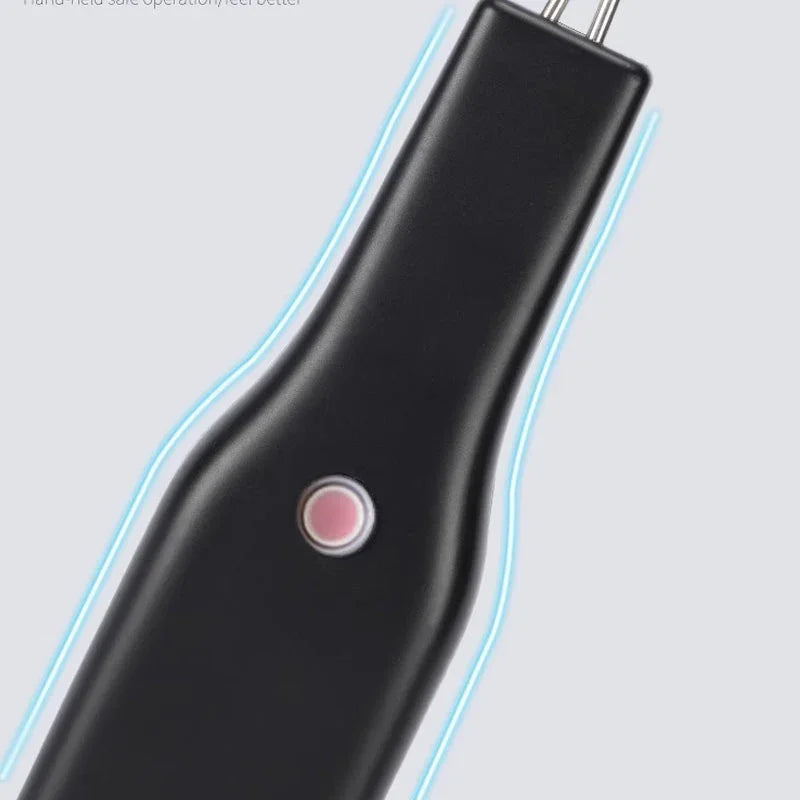 Close-up of a black handheld electronic tool with a pink button, auto tool at clarioy