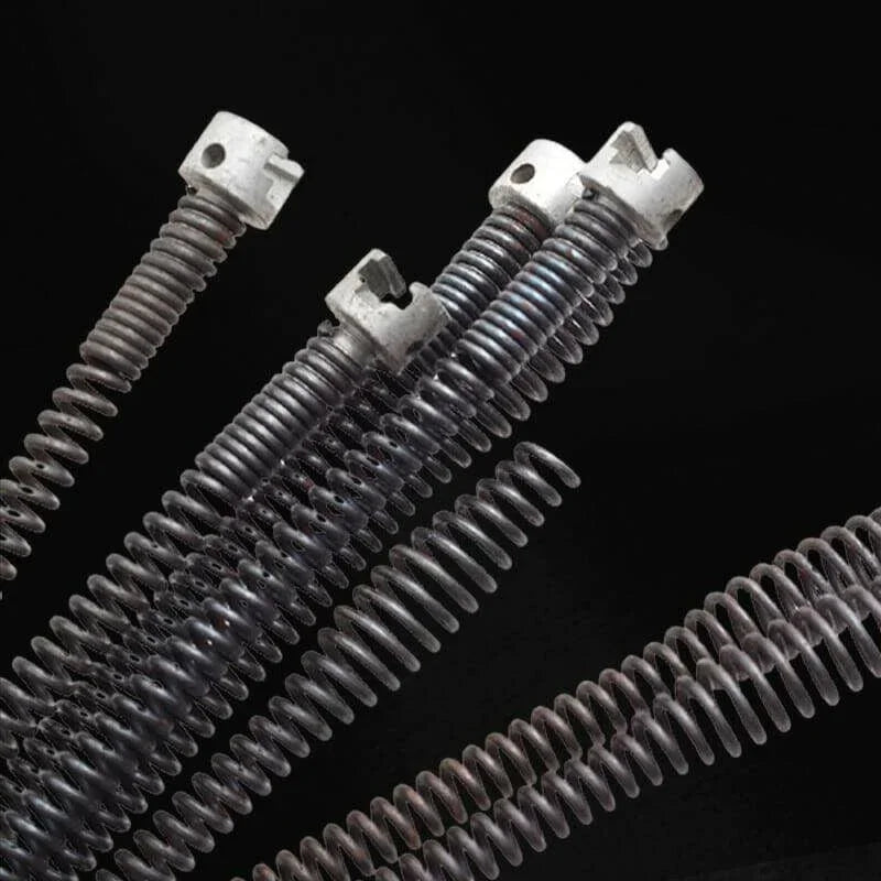 Close-up of metal coiled drain auger tools from clarioy for plumbing or home repair