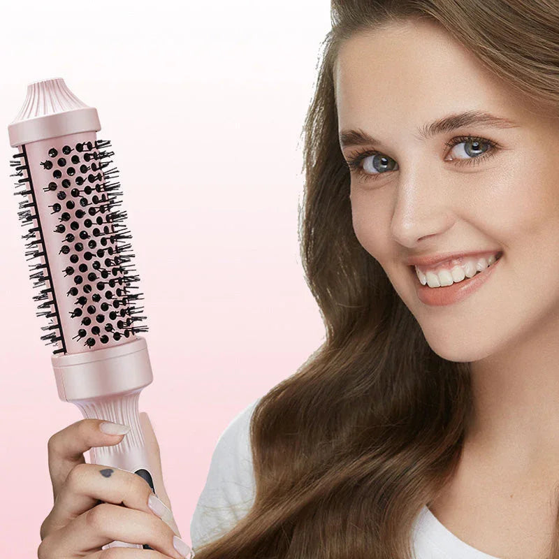 Woman smiling while holding a pink hair dryer brush, premium homeware from clarioy.