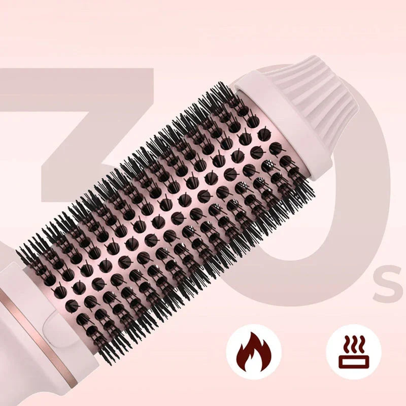 Clarioy pink heated hair styling brush with ceramic bristles on light background