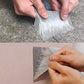 Hands applying silver waterproof repair tape to cracked concrete and a wall, clarioy home improvement tool.