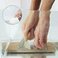 Hands applying waterproof adhesive tape to a submerged surface, demonstrating strong seal.