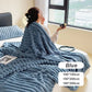 Woman sitting on bed with plush blue textured blanket and pillow by window, clarioy homeware