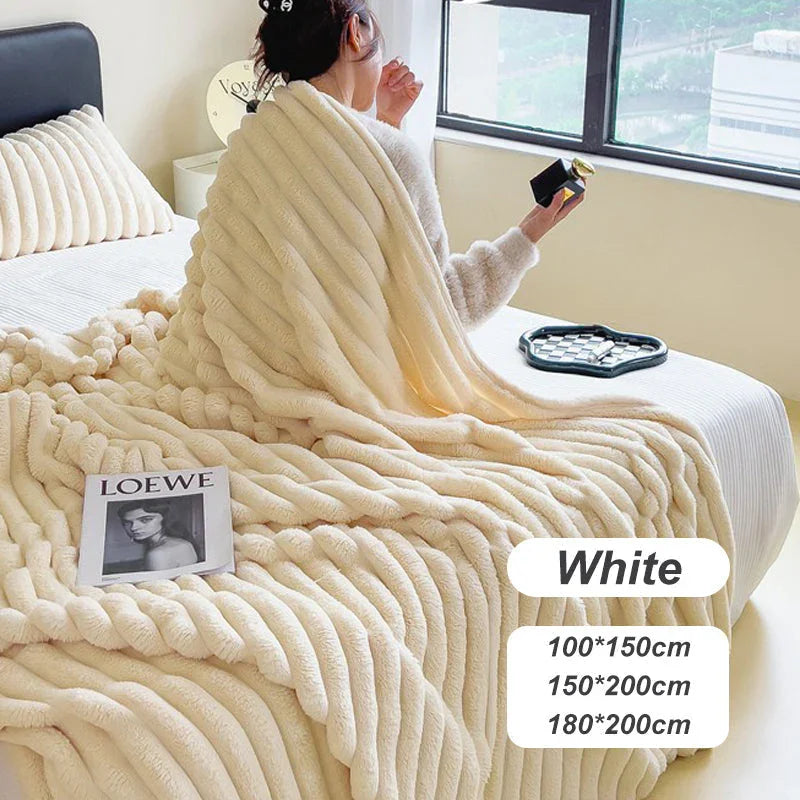 Cozy woman on bed with textured white fleece blanket, LOEWE magazine, modern bedroom decor
