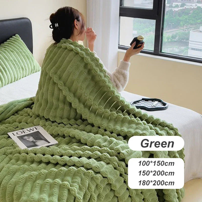 Woman on bed with green textured blanket, homeware decor, clarioy, cozy bedroom setting