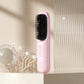 Pink electric hair straightening brush on beige shelf, modern homeware from clarioy