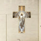 Cross wall art with Jesus in white robe, radiating light, displayed on beige wall, home decor
