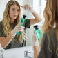 Woman applying hair dye with gloves in bathroom using premium homeware from clarioy