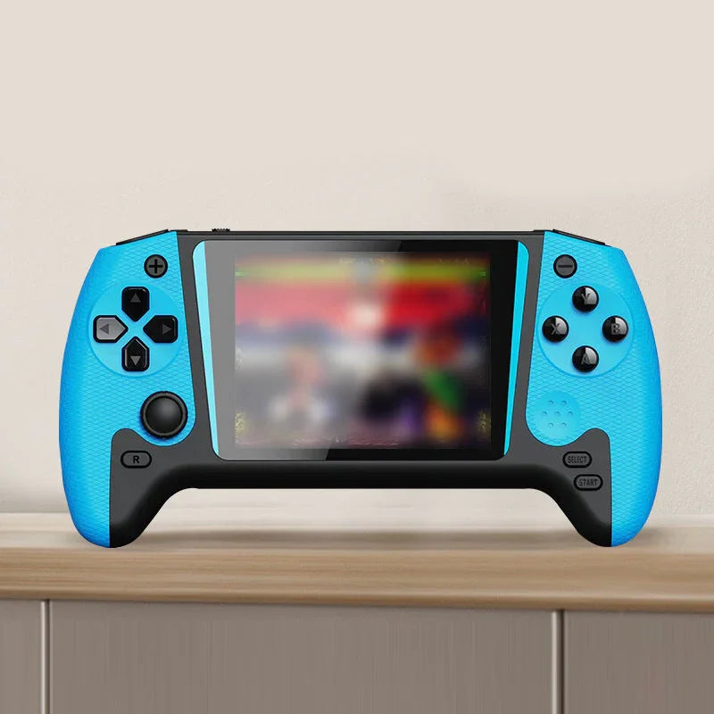 Blue and black handheld gaming console with joystick and buttons on wooden shelf