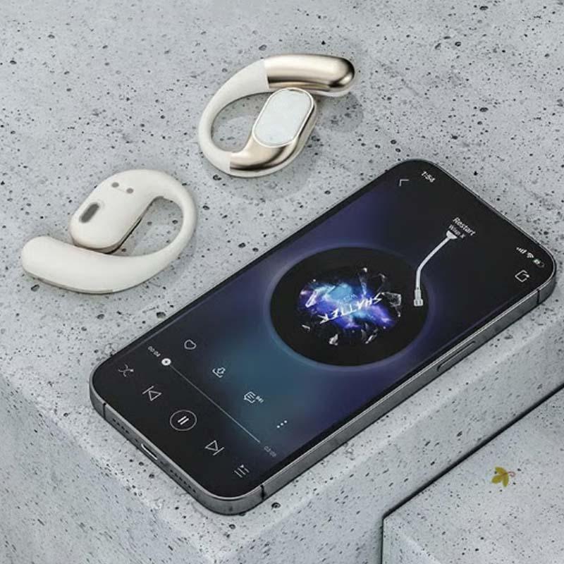 Wireless headsets and smartphone on gray stone surface, premium electronics from clarioy