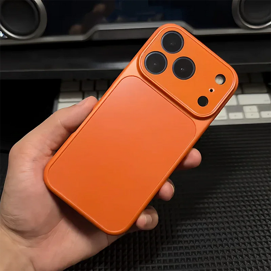 Hand holding orange iPhone case with triple camera cutout, premium phone accessory from clarioy