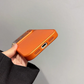 Hand holding orange iPhone case with precise port cutouts, clarioy electronics accessory
