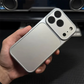 Hand holding a silver iPhone case with triple camera cutout, clarioy electronics accessory