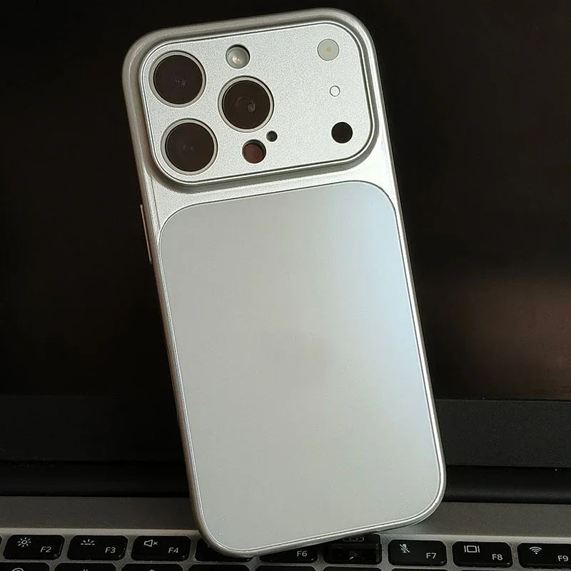 Silver iPhone case with large camera cutouts on a laptop keyboard, clarioy electronics