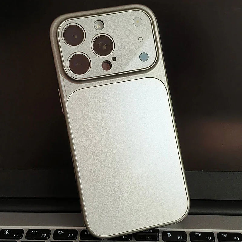 Silver iPhone with premium protective case from clarioy resting on a laptop keyboard